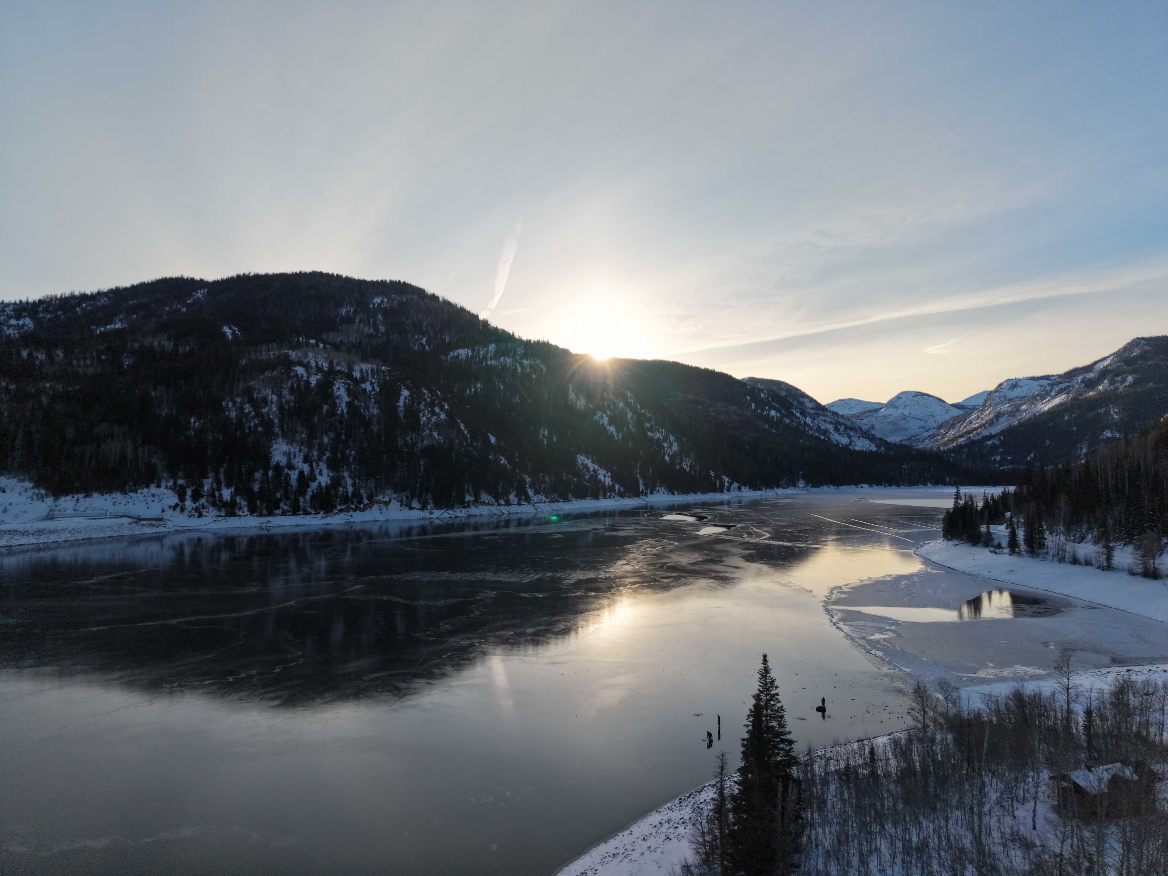 Aerial view of frozen lake at dusk